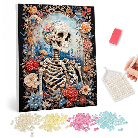 Skeleton in a Flower Arch pearl painting – Skeleton with a rose on its skull standing in an arch framed by red, peach and blue flowers