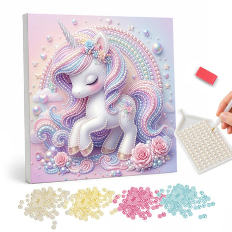 Dreamy Unicorn Under a Rainbow pearl painting – White unicorn with a flowing lilac and pink mane and closed eyes among pink roses under a rainbow