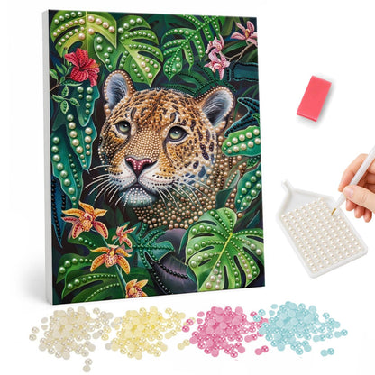 Leopard Peeking Through Monstera pearl painting – Leopard face peeking out from dense green monstera and palm leaves with orange orchids