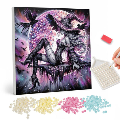 Gothic Witch and Pink Moon pearl painting – Long-haired witch in black boots reclining before a huge pink moon as ravens and bats fly around her