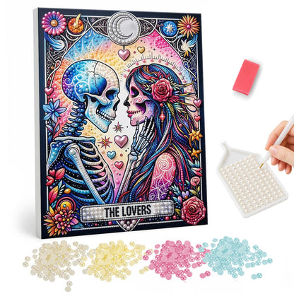 Skeleton Sweethearts Tarot pearl painting – Skeleton and a flower-crowned sugar skull woman about to kiss on an ornate tarot-style card