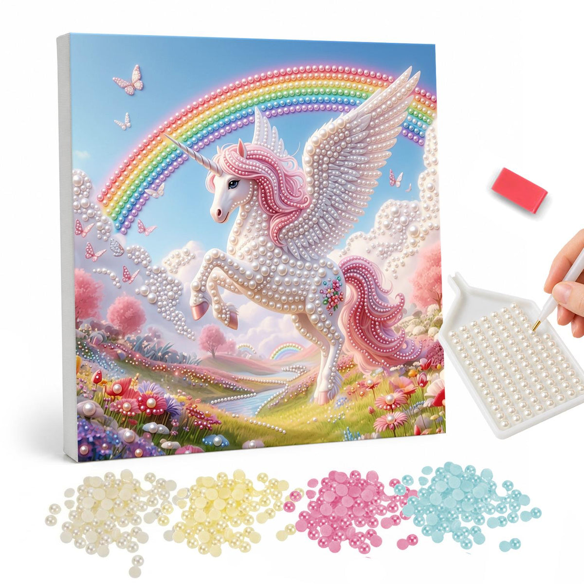 Winged Unicorn Above the Valley pearl painting – White winged unicorn with a pink mane leaping over a flowery valley under a bright rainbow