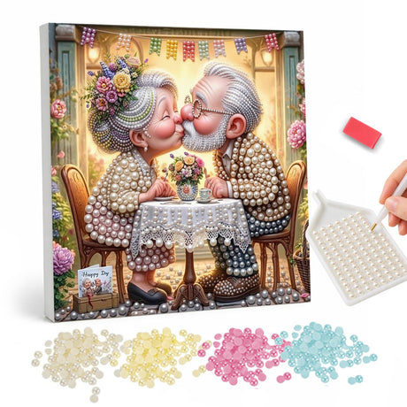 Cafe Kiss for Grandma and Grandpa pearl painting – Elderly couple sharing a kiss across a lace-covered cafe table with flowers and bunting