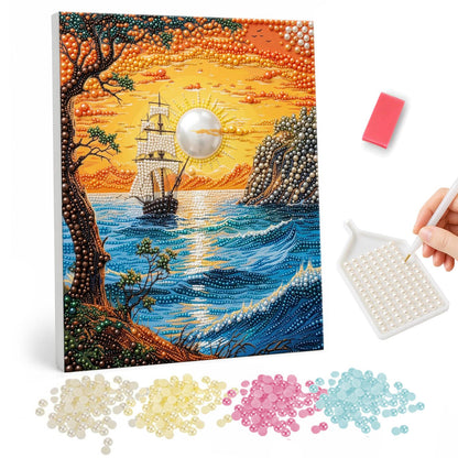 Clifftop View of a Sunset Ship pearl painting – Sailing ship on a sparkling sea at orange sunset, framed by a leafy tree and rocky cliffs