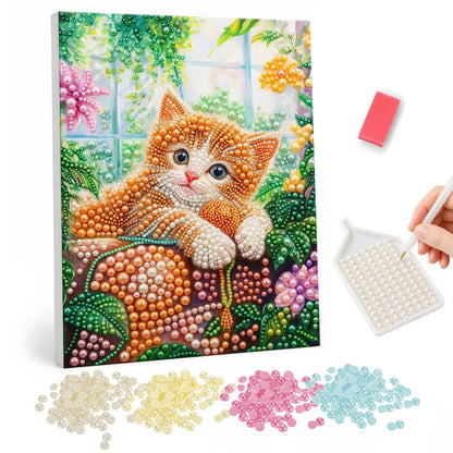 Ginger Kitten on a Mossy Ledge pearl painting – Orange and white kitten lounging on a mossy ledge among pink flowers in a bright garden room