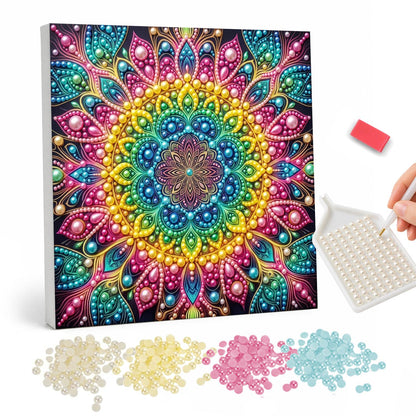 Spectrum Halo Mandala pearl painting – Square mandala with concentric rainbow rings at the center and magenta, teal and pink outer petals