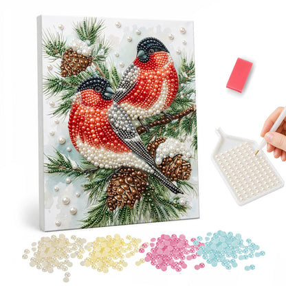 Bullfinch Pair on Pine Cones pearl painting – Two red-breasted bullfinches perched on a pine branch with pine cones and snow