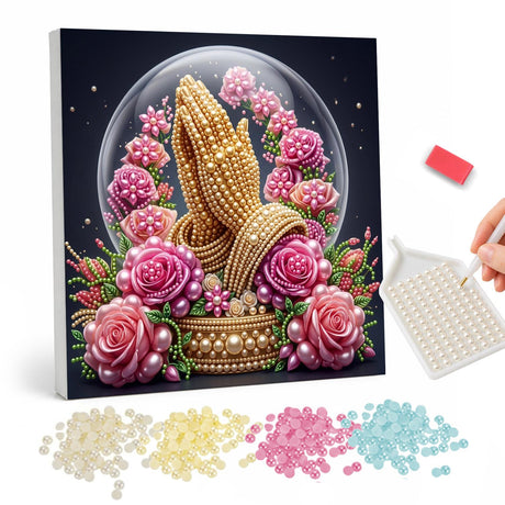 Praying Hands in a Rose Dome pearl painting – Golden praying hands inside a glass dome surrounded by pink roses on a dark background
