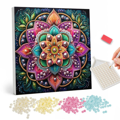 Pink Lotus Mandala on Black pearl painting – Flower mandala with magenta and pink outer petals, a teal and orange center and green leaves on black