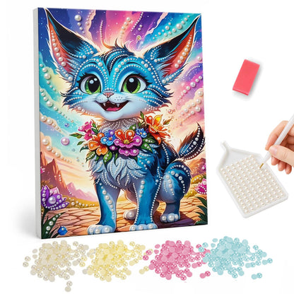 Big-Eared Kitten in Bloom pearl painting – Cartoon blue kitten with tall tufted ears and a flower garland, smiling against a pink desert sunset