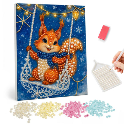 Squirrel on a Snowflake Swing pearl painting – Orange squirrel in a blue scarf sitting on a lacy snowflake swing under string lights on a snowy night