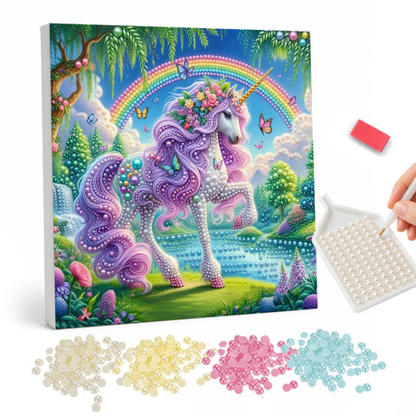 Lilac Unicorn by the Waterfall pearl painting – Lilac unicorn with a flower crown prancing in a green valley with a waterfall, rainbow and butterflies