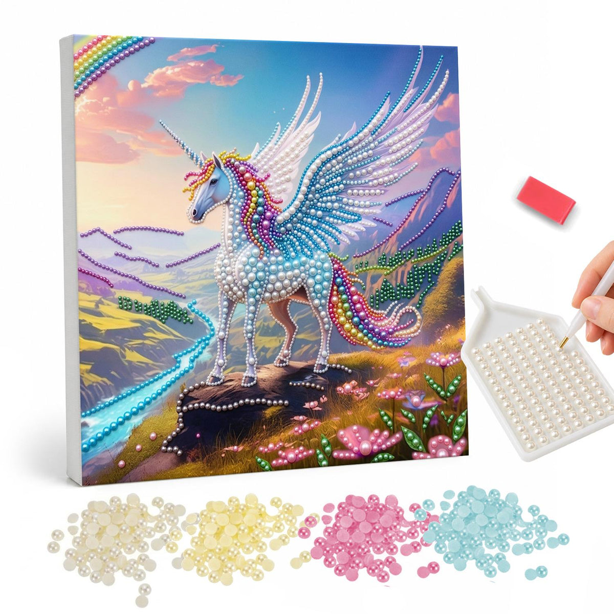 Winged Unicorn on the Ridge pearl painting – White winged unicorn with a rainbow tail standing on a rocky ridge above a river valley at sunset