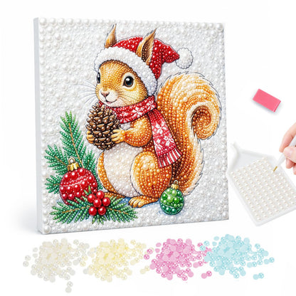 Santa-Hat Squirrel with Pine Cone pearl painting – Squirrel in a Santa hat and red scarf holding a pine cone beside red and green baubles