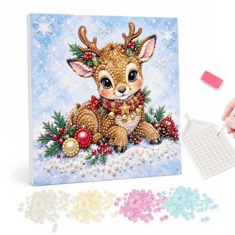Resting Fawn with Gold Baubles pearl painting – Young antlered fawn lying in snow with a holly garland, red berries and gold baubles