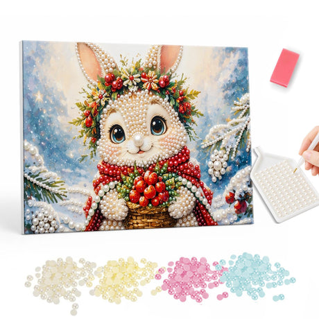 Bunny with a Berry Basket pearl painting – Bunny wearing a holly and berry crown and red scarf holding a basket of red berries in the snow