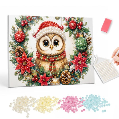 Owl in a Poinsettia Wreath pearl painting – Owl in a Santa hat framed by a wreath of poinsettias, baubles and pine cones