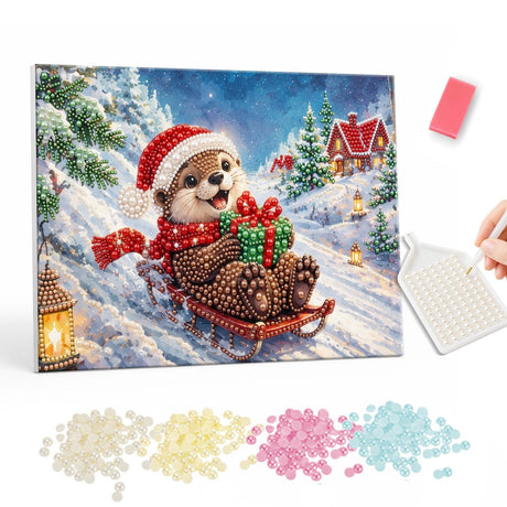 Seal Pup Sledding with Gifts pearl painting – Seal pup in a Santa hat and red scarf riding a sled of gifts down a snowy hill past a lantern