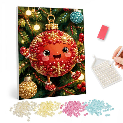 Smiling Red Bauble Buddy pearl painting – Smiling red Christmas bauble character with gold trim, arms and legs hanging on a lit tree