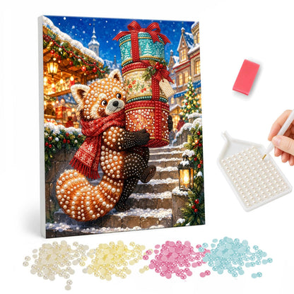 Red Panda on the Snowy Steps pearl painting – Red panda in a red scarf carrying a tall stack of gift boxes up snowy steps in a festive street
