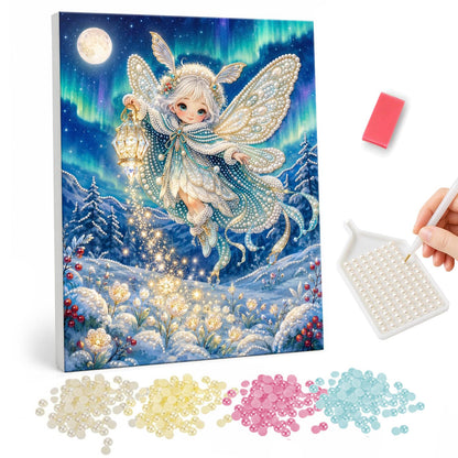 Lantern Fairy in the Snow pearl painting – Winged fairy holding a glowing lantern over a snowy landscape with aurora lights and a full moon