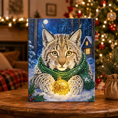 Lynx Cradling a Golden Bauble pearl painting – image 5