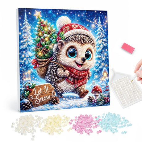 Hedgehog Carrying a Little Tree pearl painting – Hedgehog in a Santa hat and red scarf carrying a small Christmas tree beside a Let It Snow sign
