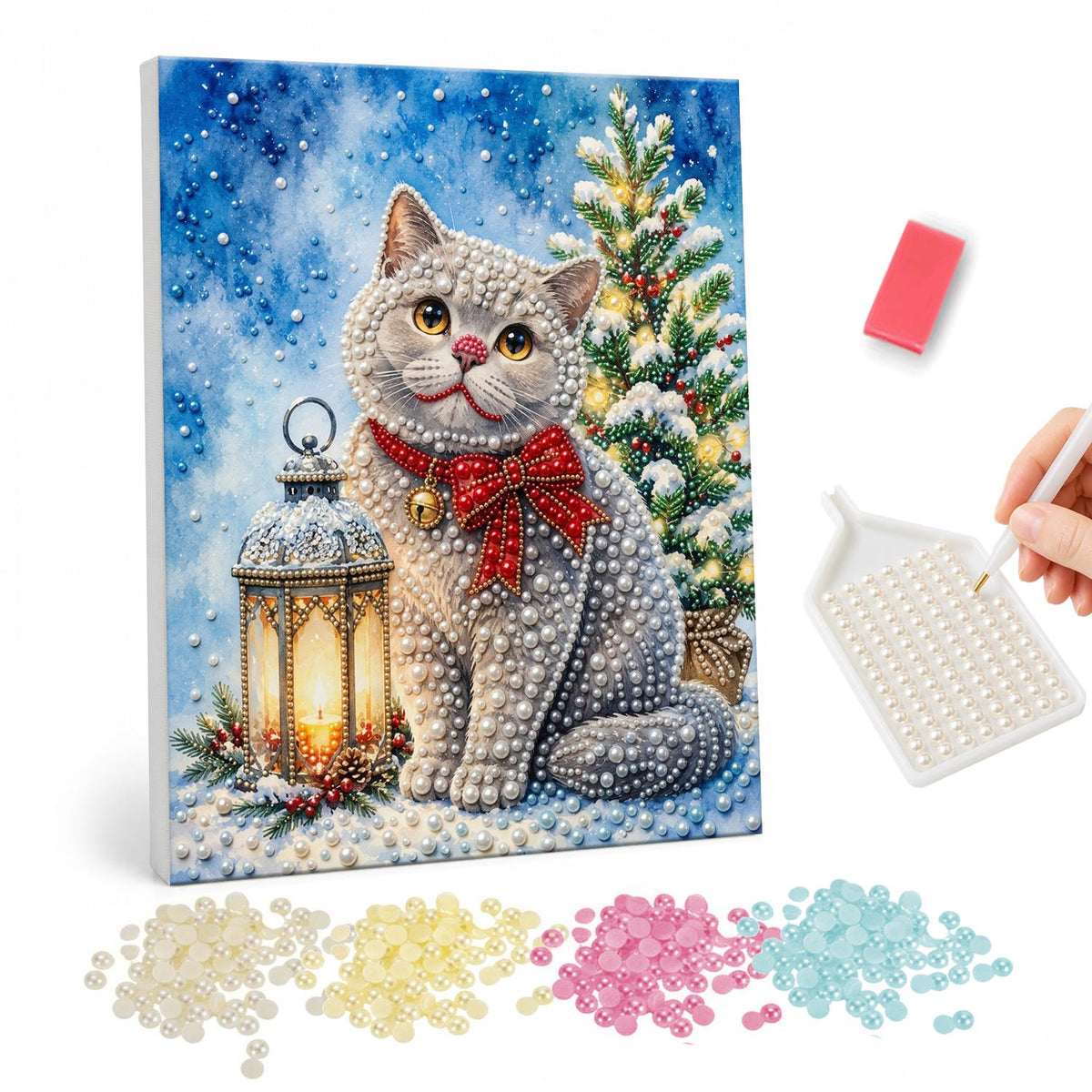 Grey Cat with a Plaid Bow pearl painting – Grey cat wearing a red plaid bow sitting in snow between a lantern and a lit Christmas tree