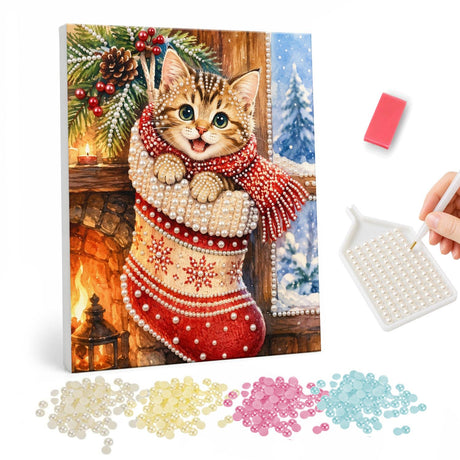 Snowflake Stocking Tabby Kitten pearl painting – Tabby kitten in a red scarf peeking out of a cream snowflake stocking by a fireplace and window