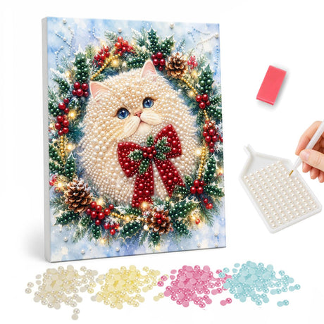 Bow-Tied Fluffy Cat Wreath pearl painting – Fluffy white cat with a red bow framed by a wreath of pine cones, berries and lights