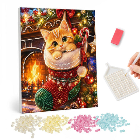 Fireside Ginger Stocking Kitten pearl painting – Ginger kitten peeking out of a red and green stocking with a candy cane beside a glowing fireplace