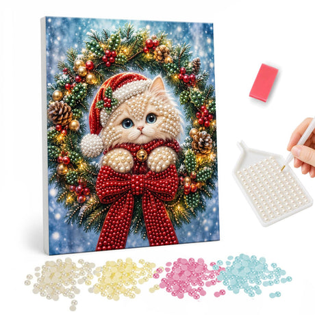 Santa-Hat Kitten in a Bow Wreath pearl painting – Cream kitten in a Santa hat peeking through a Christmas wreath with a large red bow