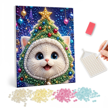 Kitten in a Christmas Tree Hood pearl painting – White kitten wearing a decorated Christmas tree hood topped with a gold star on a starry background
