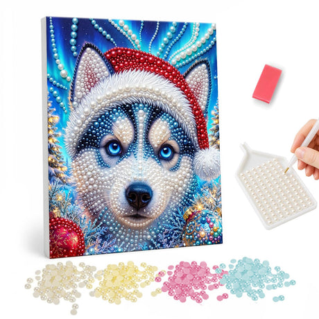 Blue-Eyed Husky in Santa Hat pearl painting – Blue-eyed husky in a Santa hat against a glittering teal background with baubles