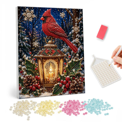 Cardinal Atop a Candle Lantern pearl painting – Red cardinal perched on an ornate lantern with a lit candle among pine cones and berries
