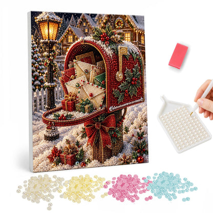 Letter-Stuffed Red Mailbox pearl painting – Red mailbox overflowing with letters, trimmed with holly and a bow beside a lamppost in the snow