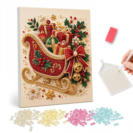 Gold-Runner Sleigh of Presents pearl painting – Red sleigh with gold runners loaded with gifts, a red bow and bells on a cream background