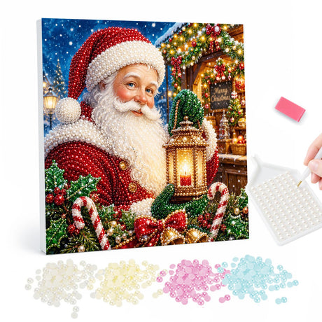 Santa and the Candle Lantern pearl painting – Smiling Santa beside a candle lantern and candy canes in front of a festive lit shopfront