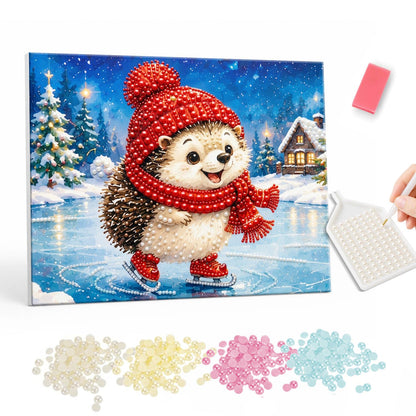 Hedgehog on the Frozen Pond pearl painting – Smiling hedgehog in a red pom-pom hat and scarf ice skating on a frozen pond near a snowy cottage