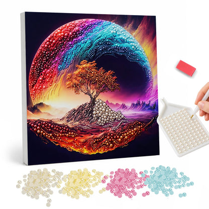 Lone Tree in a Rainbow Swirl pearl painting – Orange-leaved tree on a glowing red hill encircled by a sweeping rainbow wave in a dark sky