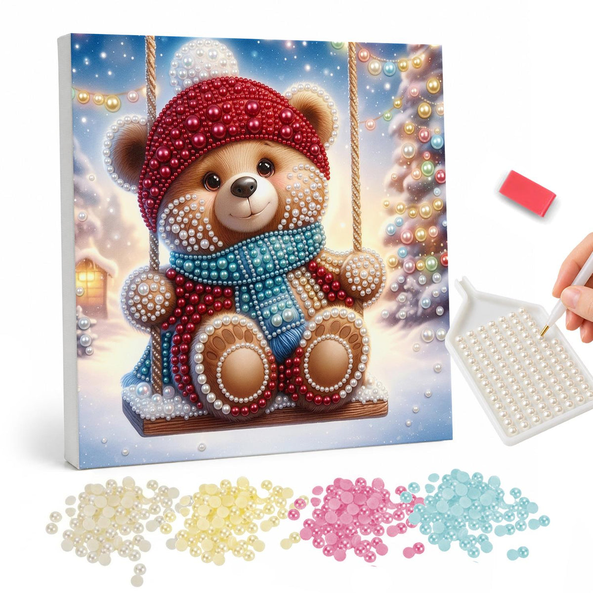 Bobble-Hat Teddy on a Swing pearl painting – Teddy bear in a red knit hat and blue scarf sitting on a rope swing in the snow