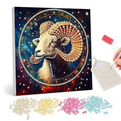 Aries Ram in the Zodiac Wheel pearl painting – Ram with large curled golden horns inside a zodiac wheel on a starry red and blue cosmic background