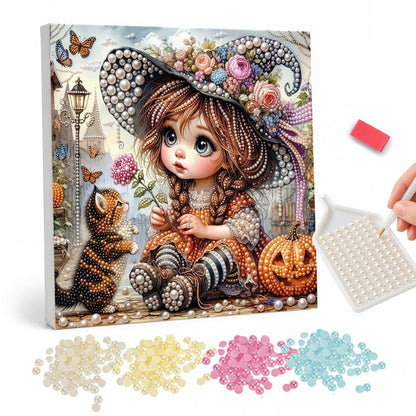 Big-Eyed Girl and Tabby Cat pearl painting – Big-eyed girl in a flower-trimmed witch hat sitting with a tabby cat beside a jack-o'-lantern and butterflies
