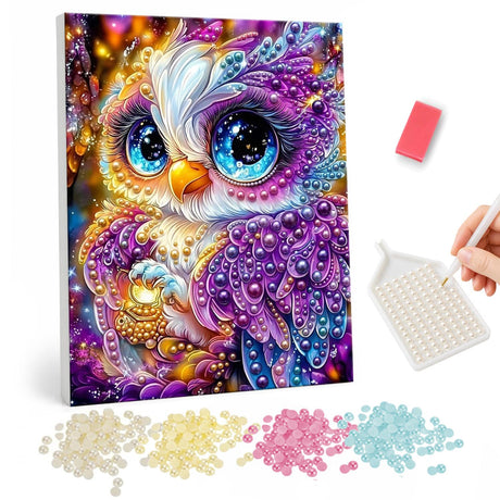 Violet Owl with Sapphire Eyes pearl painting – Purple owl with big glittering blue eyes and jeweled feathers on a golden background