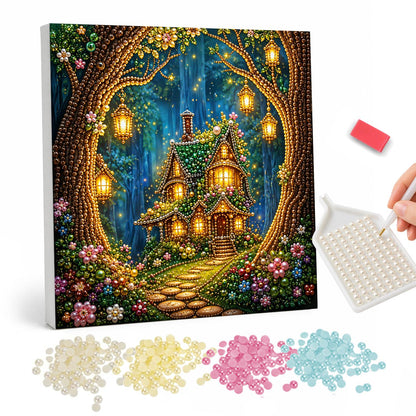 Lantern-Hung Tree Hollow Cottage pearl painting – Glowing cottage seen through an arch of tree trunks hung with lanterns, flowers along a stone path