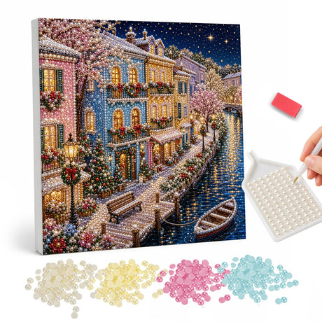 Snowy Canal Town at Night pearl painting – Colorful townhouses along a snowy canal at night with lamps, blossom trees and a moored rowboat
