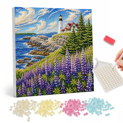 Lupine Bluff Lighthouse pearl painting – White lighthouse on a rocky coast above the sea, with pine trees and purple lupines in front