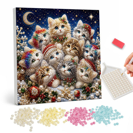 Festive Kitten Huddle pearl painting – Group of fluffy kittens in Santa hats and holly under a crescent moon and starry sky