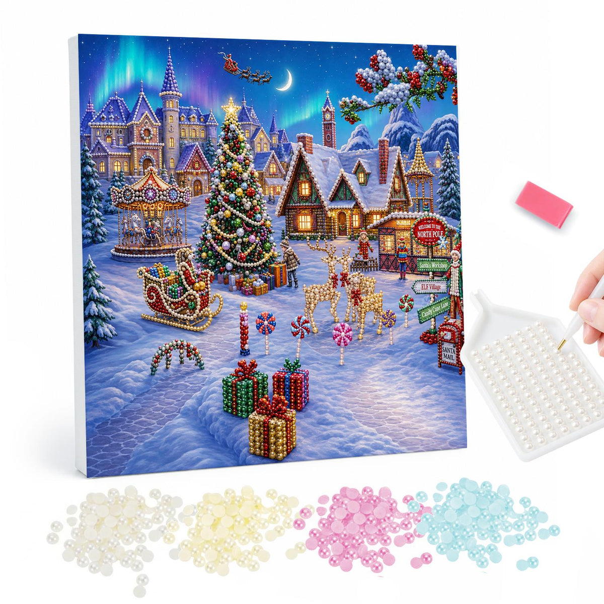 Aurora Over the Carousel Village pearl painting – Snowy holiday village with a lit tree, carousel, reindeer and gifts on the road beneath a green aurora