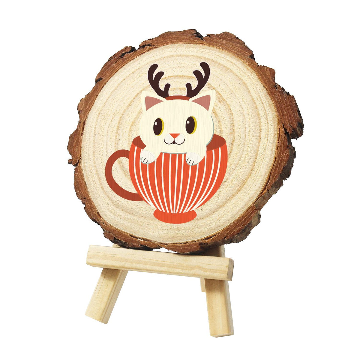 Reindeer Kitten in a Striped Cup paint by numbers wood slice – Cream kitten wearing brown reindeer antlers, peeking out of a red and white striped teacup, painted on a pine slice on a small easel